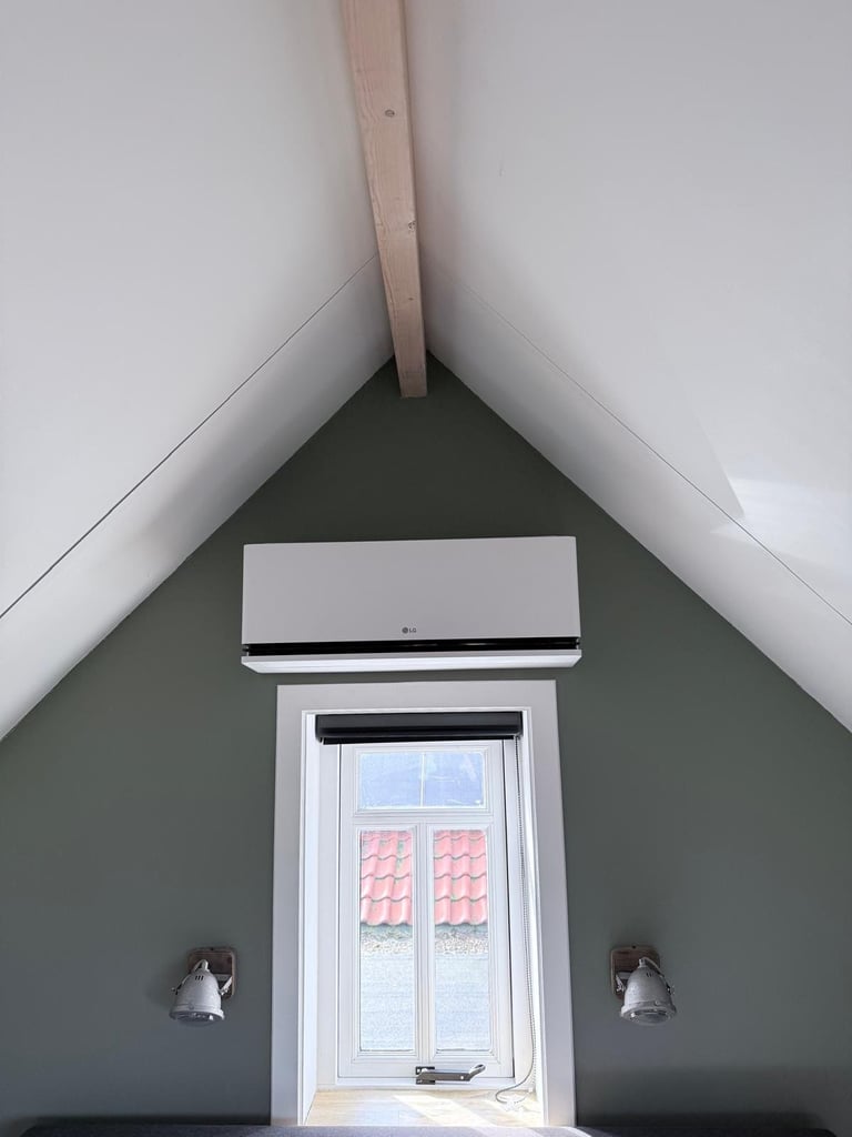Attic room with gable ceiling, white trim door with pink shutters, sconces on dark green walls, and exposed beam overhead